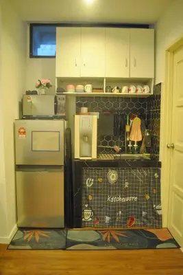 a kitchen with a refrigerator and a counter top at Fahrenheit 88 Suites Bukit Bintang C 3R in Kuala Lumpur