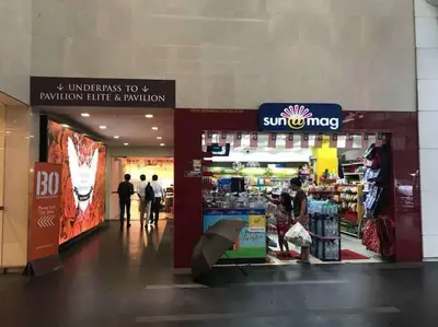 a store with people walking in a mall with an umbrella at Fahrenheit 88 Suites Bukit Bintang C 3R in Kuala Lumpur