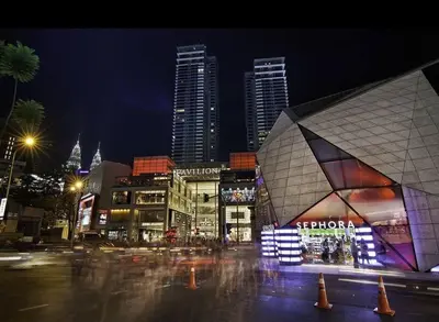 a city street at night with a building and buildings at Fahrenheit 88 Suites Bukit Bintang C 3R in Kuala Lumpur
