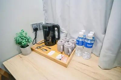a table with bottles of water and a blender at Kingston Hotel 8 - Kuala Lumpur Bukit Bintang in Kuala Lumpur