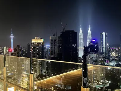 a view of a city skyline at night at Agile Residence TRX Bukit Bintang by Cal in Kuala Lumpur