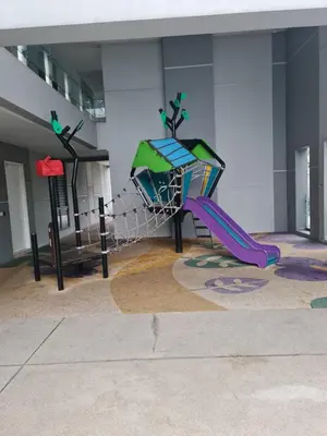 a playground with a slide in a building at The Robertson Residence in bukit bintang in Kuala Lumpur