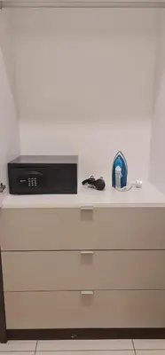 a white counter top with a microwave on top of it at The Robertson Residence in bukit bintang in Kuala Lumpur