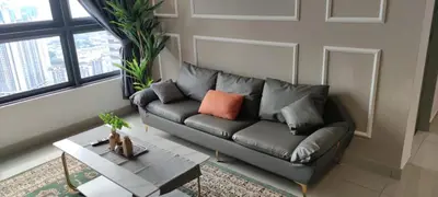 a living room with a couch and a table at M Vertica KL 3br for 6pax by Wowhome in Kuala Lumpur