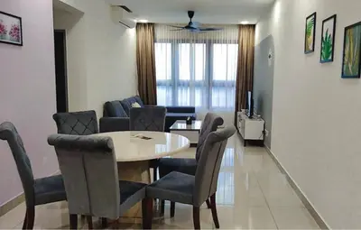 a dining room and living room with a table and chairs at M Vertica KL 3br for 6pax by Wowhome in Kuala Lumpur