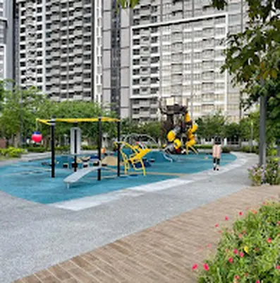 a playground with yellow equipment in a city at M Vertica KL 3br for 6pax by Wowhome in Kuala Lumpur