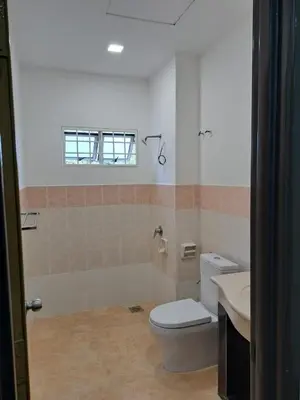 a bathroom with a toilet and a sink at Double-story House in Kuala Lumpur in Ampang