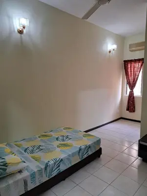 a bedroom with a bed in a room with a window at Double-story House in Kuala Lumpur in Ampang