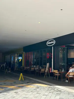 a store with tables and chairs in front of it at Sunway Velocity Two Deluxe in Kuala Lumpur