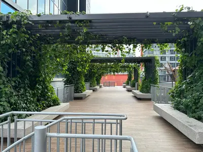 an archway with a bench and plants in a building at Sunway Velocity Two Deluxe in Kuala Lumpur