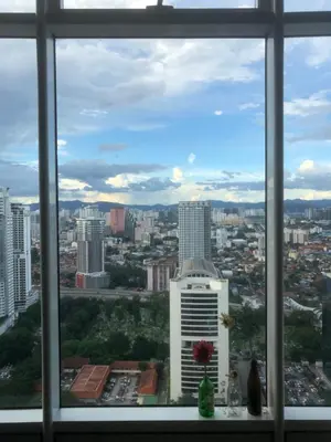 a view of a city from a window at Sky Suites KLCC by Psalm Space exclusively for female travellers in Kuala Lumpur