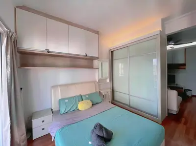 a bedroom with a large bed with blue sheets at Comfy Studio Casa Mutiara, Near LRT Hang Tuah & Lalaport in Kuala Lumpur