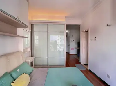a bedroom with a large bed with a couch at Comfy Studio Casa Mutiara, Near LRT Hang Tuah & Lalaport in Kuala Lumpur