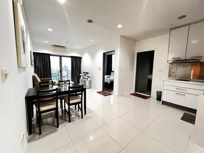 a kitchen and dining room with a table and chairs at Summer Suites Studio With Balcony Nearby KL City Centre in Kuala Lumpur