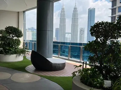 a view of a city skyline from a building at Eaton Residence Suites KLCC in Kuala Lumpur