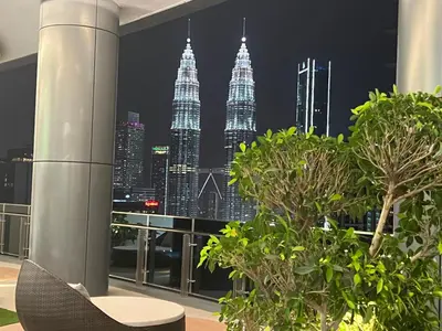 a view of the kuala lumpur city skyline at night at Eaton Residence Suites KLCC in Kuala Lumpur