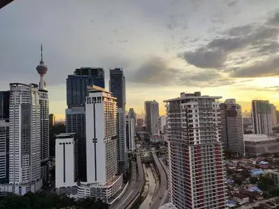 a view of a city with tall buildings at Sophia Homestay KLCC in Kuala Lumpur