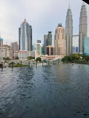 a view of a city from a boat in the water at Sophia Homestay KLCC in Kuala Lumpur