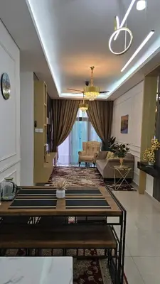 a living room with a couch and a table at Sophia Homestay KLCC in Kuala Lumpur