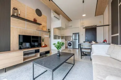 a living room with a couch and a table at Modern Design 2BR Astoria in Kuala Lumpur