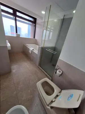 a bathroom with a toilet and a shower at Best Apartment Suite At Times Square KL in Kuala Lumpur