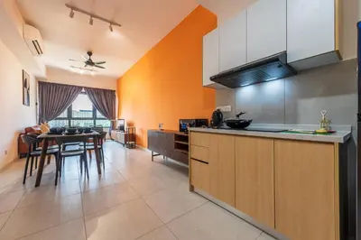 a kitchen with a table and a dining room at The Pano by Minsu in Kuala Lumpur