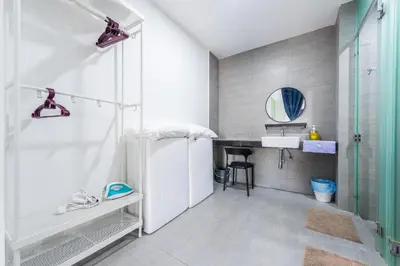 a bathroom with a shower and a sink at The Pano by Minsu in Kuala Lumpur
