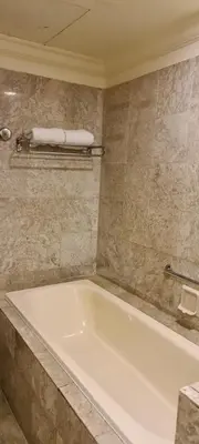 a bathroom with a white tub in a room at Soho Service Suite at Times Square KL in Kuala Lumpur