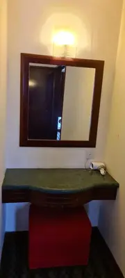 a bathroom with a sink and a mirror at Soho Service Suite at Times Square KL in Kuala Lumpur