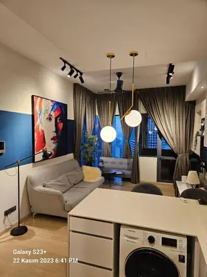 a living room with a couch and a table at Star Residence T1, 2br Unit Floor 36 in Kuala Lumpur