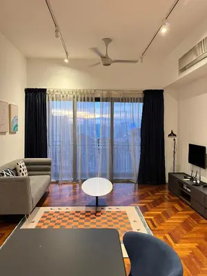 a living room with a couch and a table at Atmoods - The Mews KLCC in Kuala Lumpur