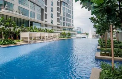 a large swimming pool in the middle of a building at Mid Night Realm Kuala Lumpur in Kuala Lumpur