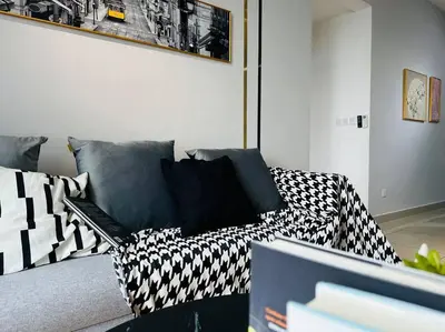 a living room with a couch with black and white pillows at MVA17#Family Suite 8pax 3 Rooms M Vertica Velocity Mall Cheras IKEA Mytown Short Walk to MRT & LRT Maluri in Kuala Lumpur