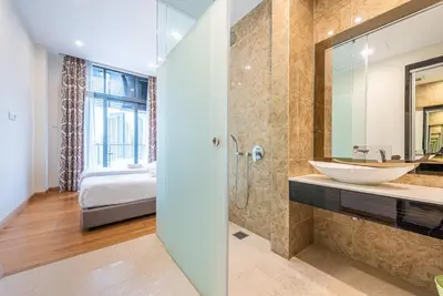 a bathroom with a sink and a mirror at Dorsett Residence Kuala Lumpur 8 pax in Kuala Lumpur