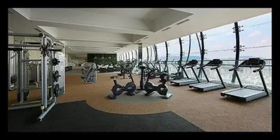 a gym with cardio equipment and a view of the ocean at Mcity Residence way to KLCC in Kuala Lumpur