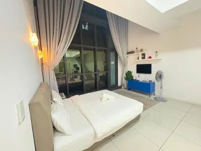 a bedroom with a bed and a large window at Mcity Residence way to KLCC in Kuala Lumpur