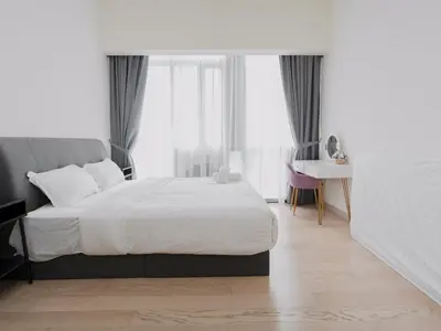 a bedroom with a large white bed and a desk at Star KLCC Twin Tower Suite 2-3pax by DingDing in Kuala Lumpur