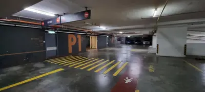 an empty parking garage with yellow lines on the floor at Star KLCC Twin Tower Suite 2-3pax by DingDing in Kuala Lumpur