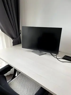 a computer monitor sitting on top of a desk at Binjai 8 Soho Premium Near KLCC & LRT KLCC in Kuala Lumpur
