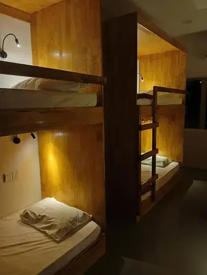 a room with two bunk beds in a room at Monkey Mansion Signature in Kuala Lumpur