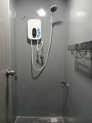 a shower head on a wall in a bathroom at Monkey Mansion Signature in Kuala Lumpur