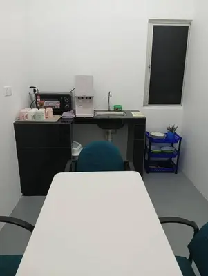 an office with a desk and two chairs and a table at Monkey Mansion Signature in Kuala Lumpur