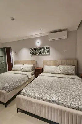 a bedroom with two beds at Bukit Bintang Pavilion KLCC Wisma Cosway in Kuala Lumpur
