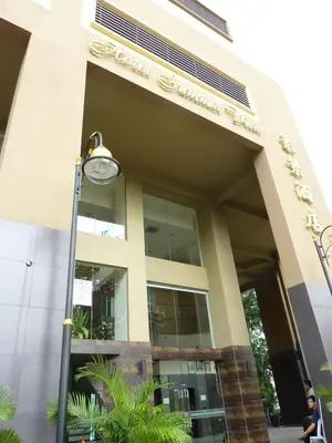 a building with a street light in front of it at Hotel Summer View in Kuala Lumpur