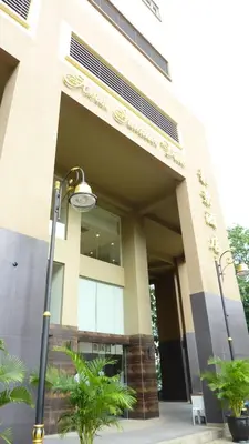 a building with a street light in front of it at Hotel Summer View in Kuala Lumpur