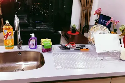 a kitchen counter with a sink and cleaning products on it at KLCC sky view 1BR luxury suites with Balcony Trion A5507 KL in Kuala Lumpur