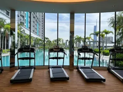 a gym with a swimming pool in a building at KLCC sky view 1BR luxury suites with Balcony Trion A5507 KL in Kuala Lumpur