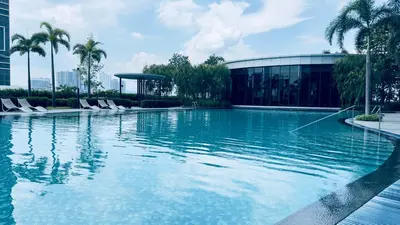 a large swimming pool in front of a building at KLCC sky view 1BR luxury suites with Balcony Trion A5507 KL in Kuala Lumpur