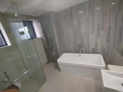 a bathroom with a tub and a shower and a sink at M City Ampang By Klcc View in Kuala Lumpur