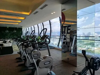 a gym with treadmills and cardio equipment in a building at M City Ampang By Klcc View in Kuala Lumpur